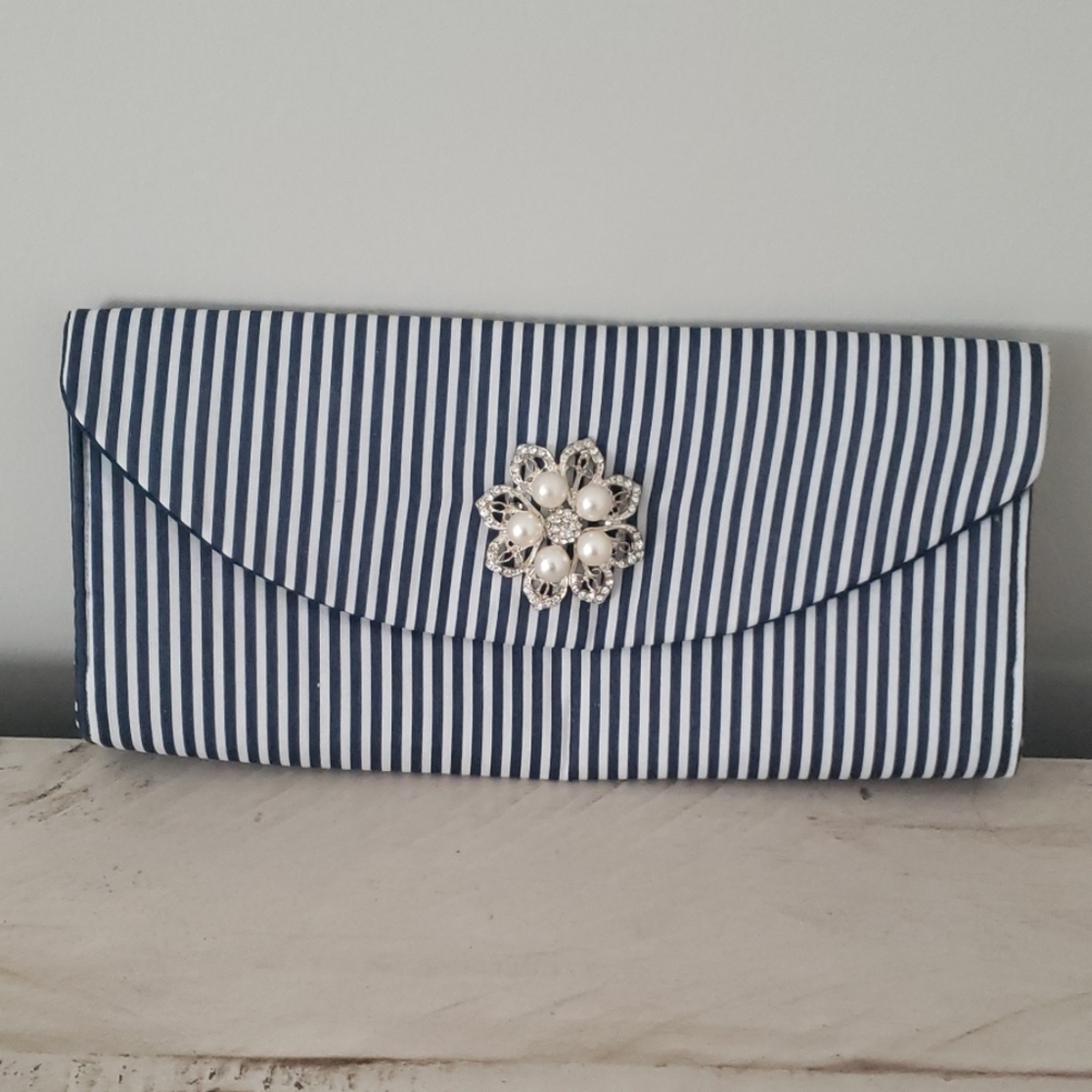Navy and white striped clutch